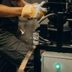 Man working on steel fatory and equipment for steel production